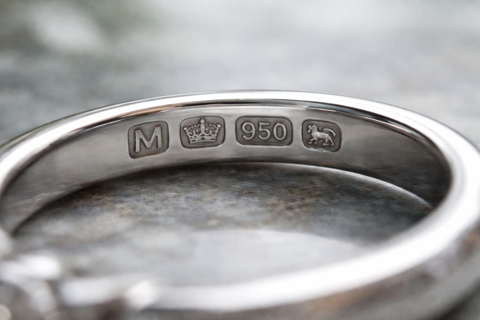 Close-up of UK platinum hallmarks on a ring shank